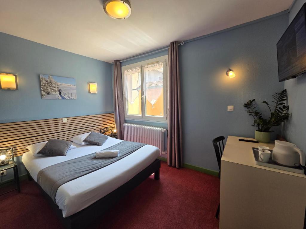Postel nebo postele na pokoji v ubytování Hotel Magdeleine