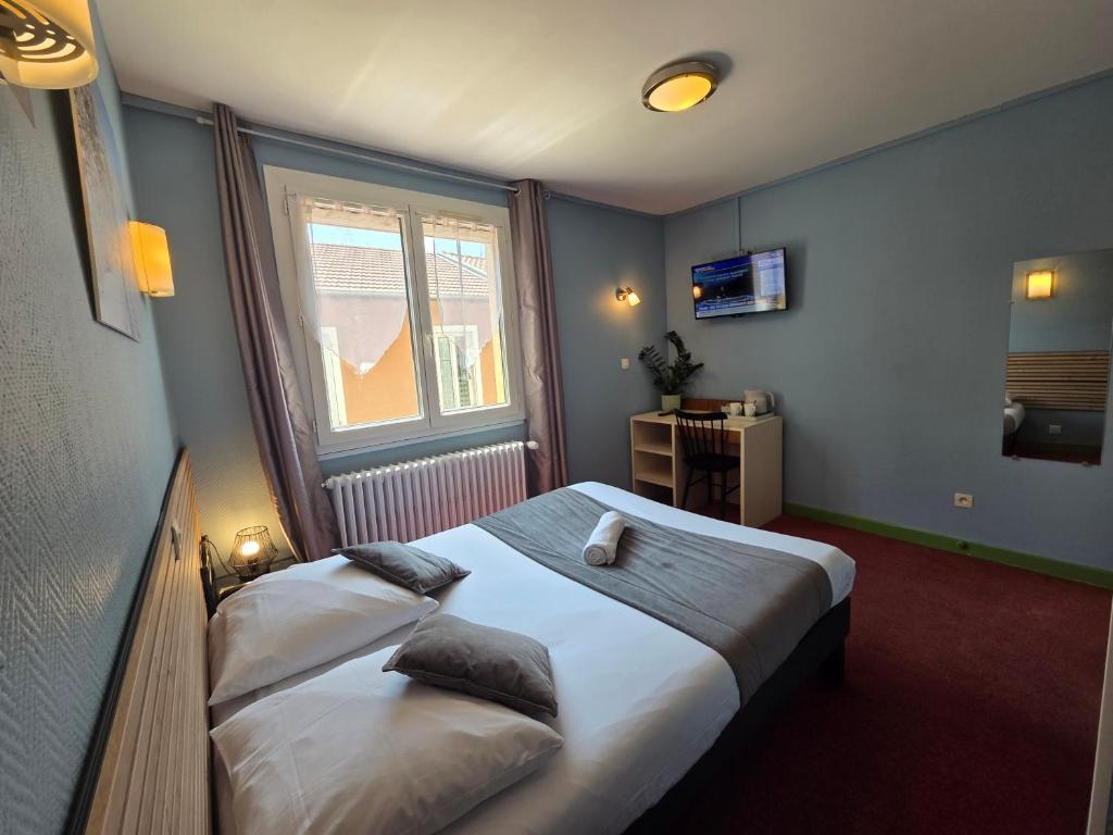 Postel nebo postele na pokoji v ubytování Hotel Magdeleine