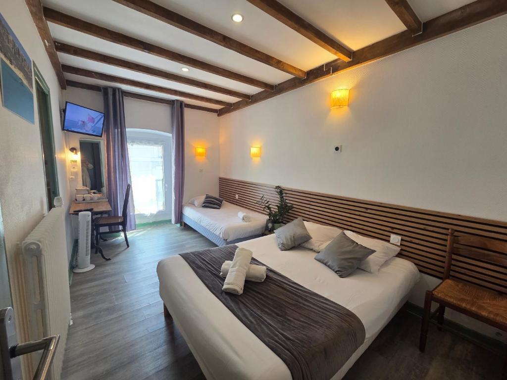 Postel nebo postele na pokoji v ubytování Hotel Magdeleine
