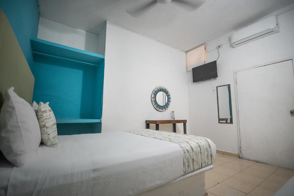 Postel nebo postele na pokoji v ubytování Hotel Posada Aurora