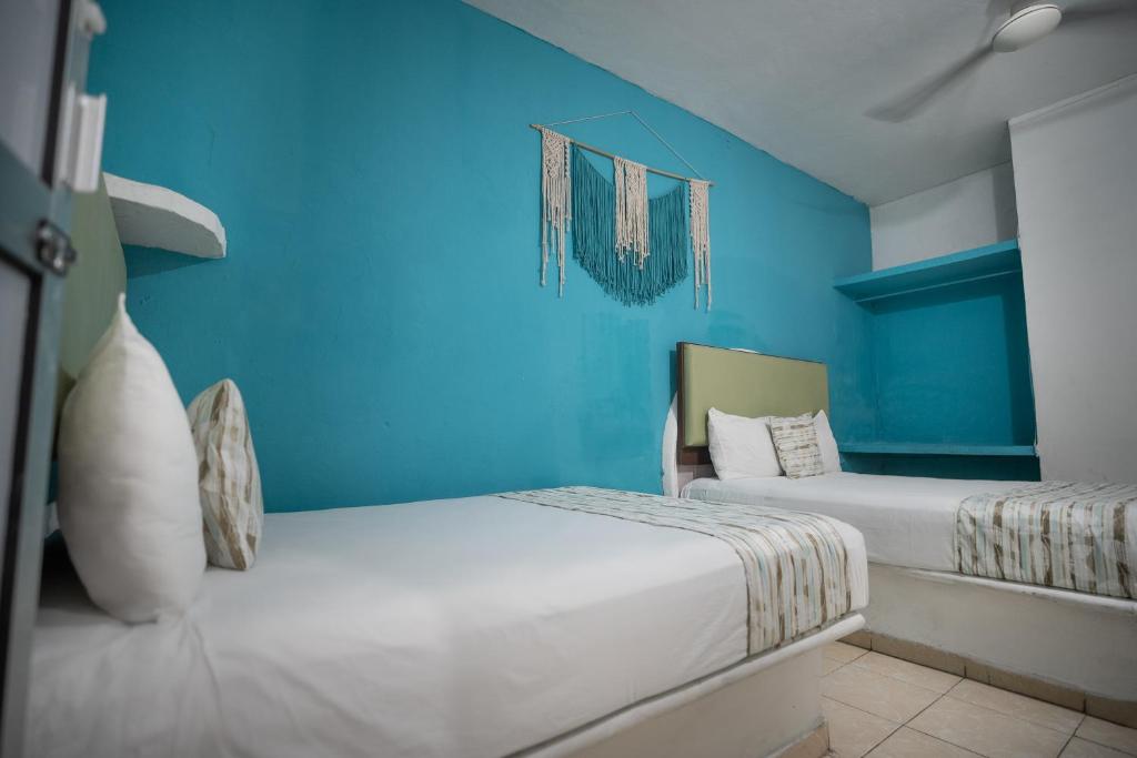 Postel nebo postele na pokoji v ubytování Hotel Posada Aurora