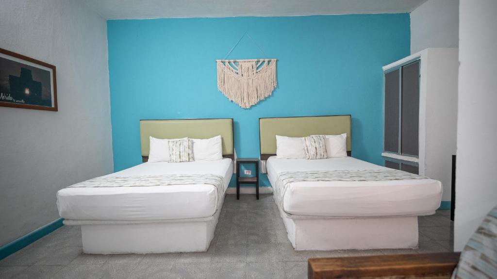 Postel nebo postele na pokoji v ubytování Hotel Posada Aurora