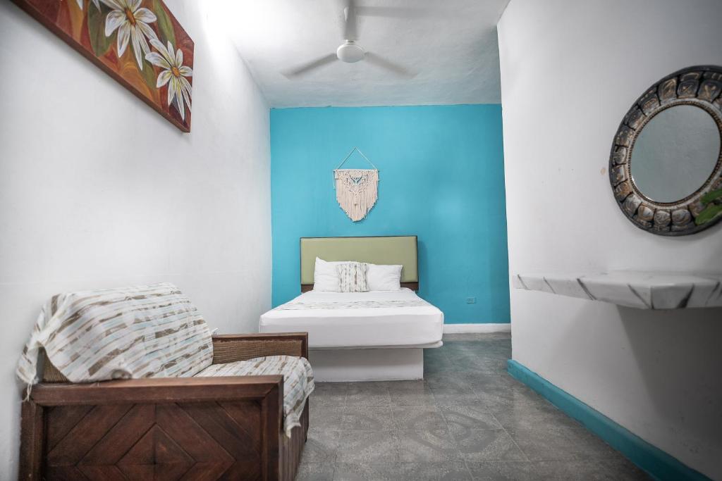 Postel nebo postele na pokoji v ubytování Hotel Posada Aurora