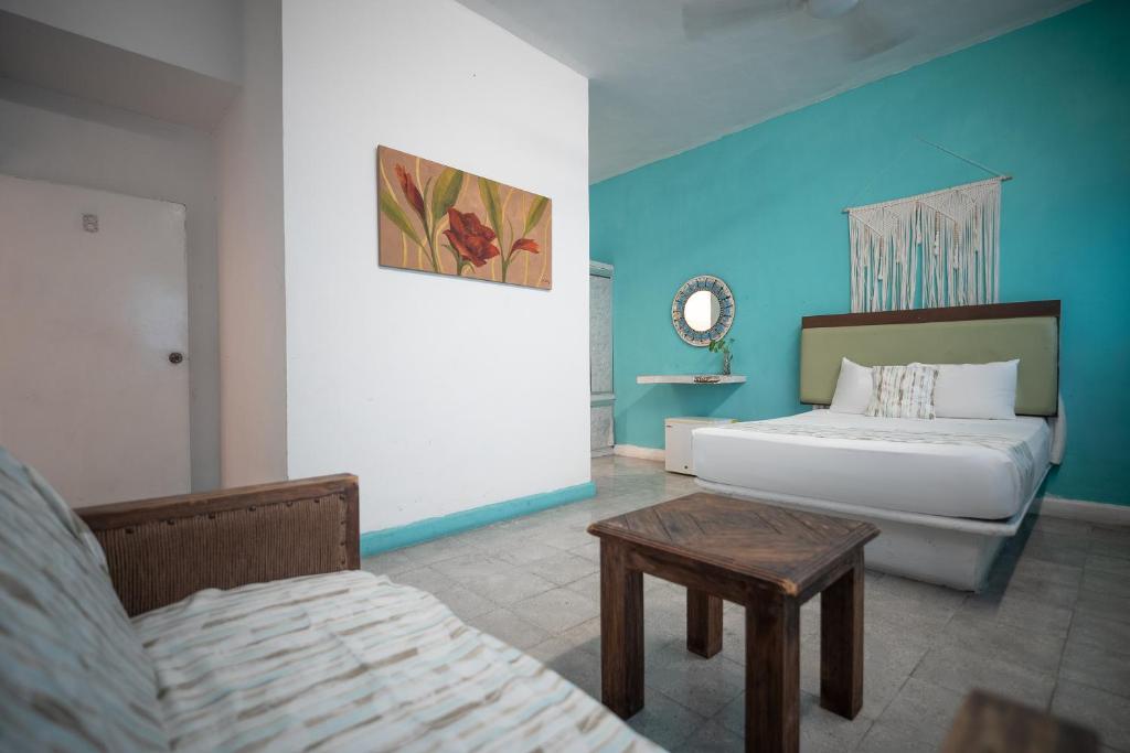 Postel nebo postele na pokoji v ubytování Hotel Posada Aurora