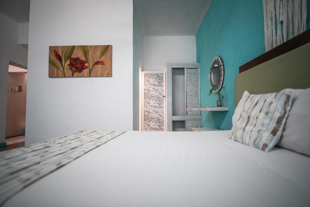 Postel nebo postele na pokoji v ubytování Hotel Posada Aurora