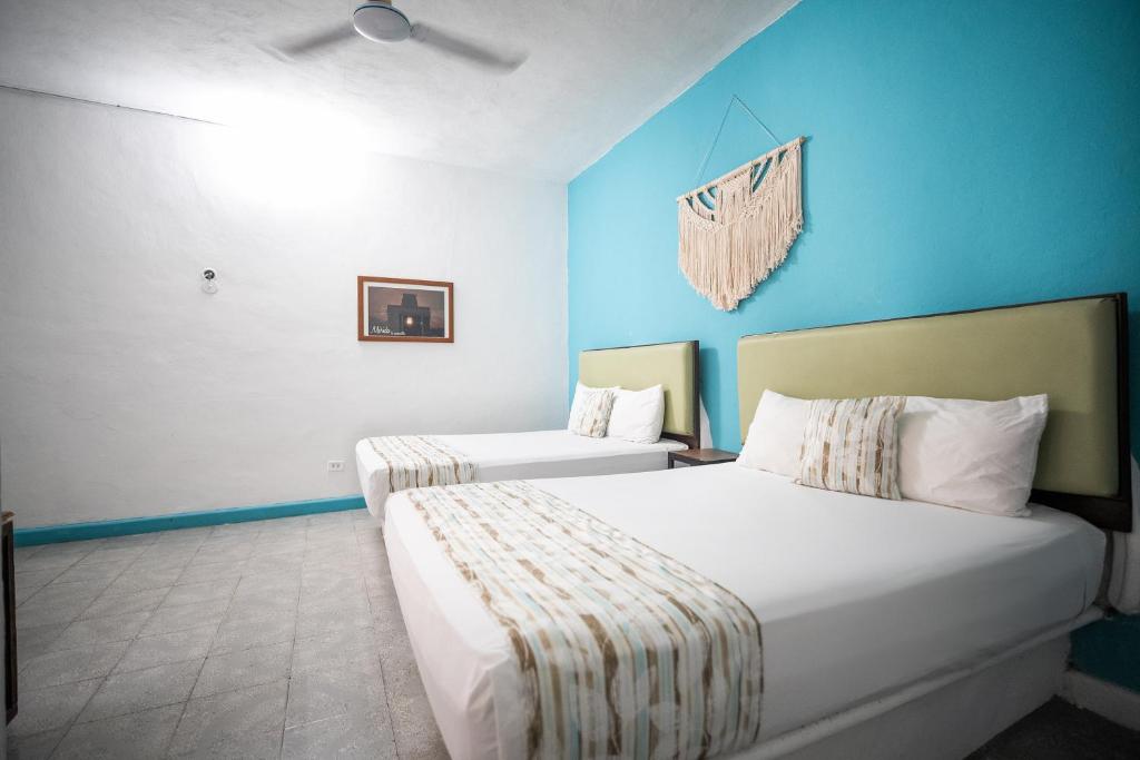 Postel nebo postele na pokoji v ubytování Hotel Posada Aurora