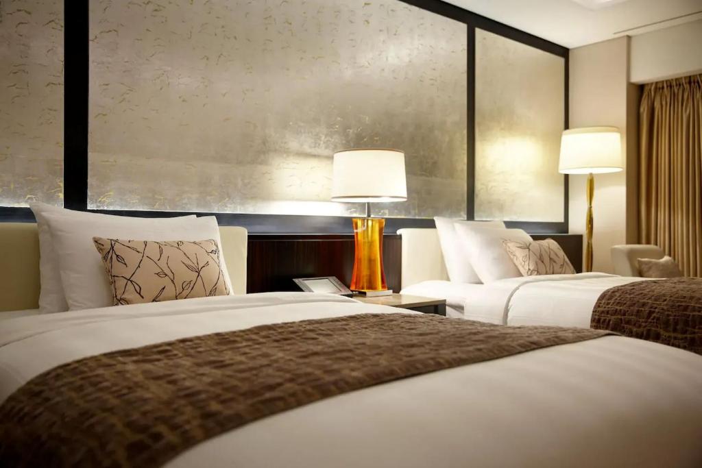 Postel nebo postele na pokoji v ubytování Hotel Loft Near IGI Airport Delhi