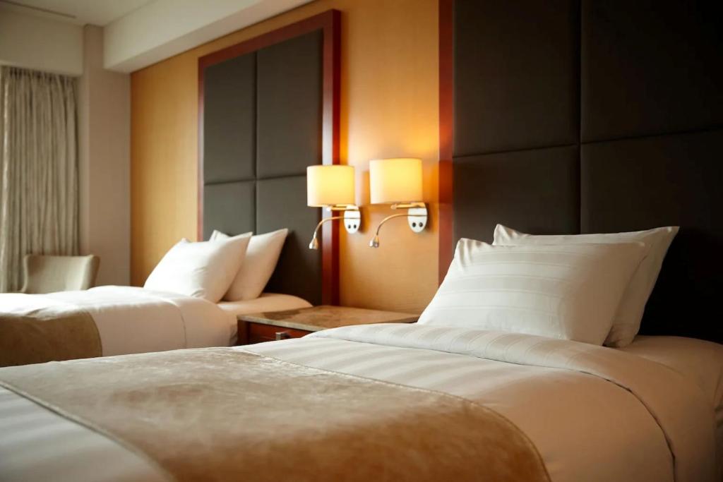 Postel nebo postele na pokoji v ubytování Hotel Loft Near IGI Airport Delhi