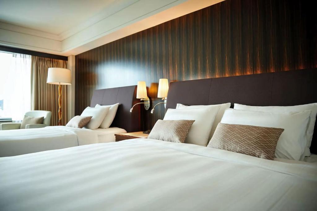 Postel nebo postele na pokoji v ubytování Hotel Loft Near IGI Airport Delhi