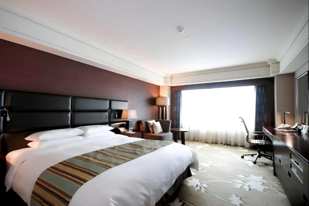 Postel nebo postele na pokoji v ubytování Hotel Loft Near IGI Airport Delhi