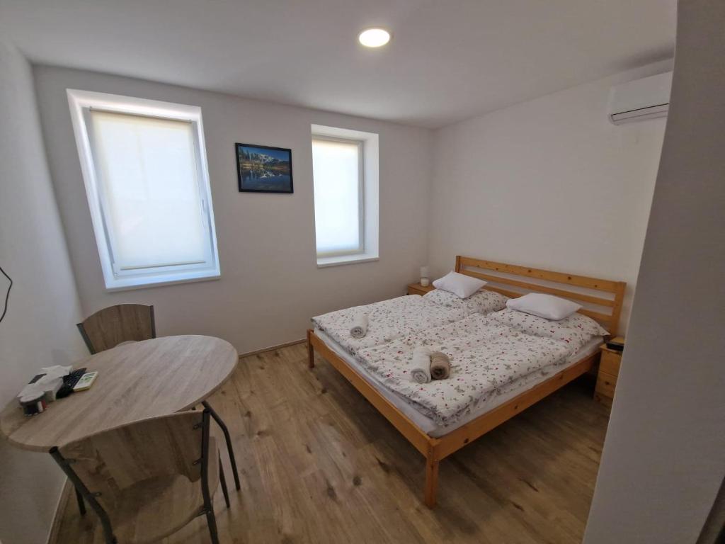 Postel nebo postele na pokoji v ubytování Mura Regnum Panzió
