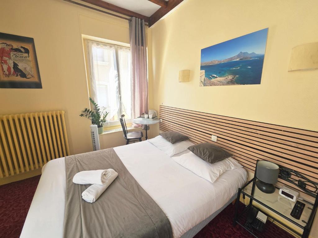 Postel nebo postele na pokoji v ubytování Hotel Magdeleine