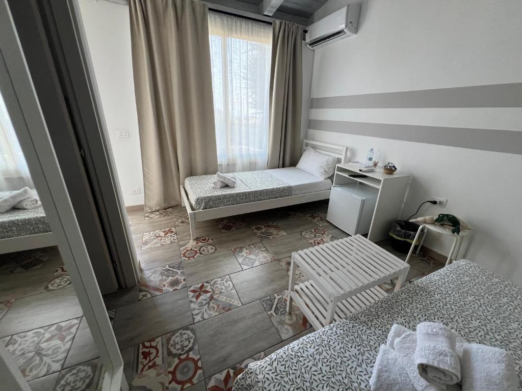 Postel nebo postele na pokoji v ubytování Cozzo Spadaro B&B