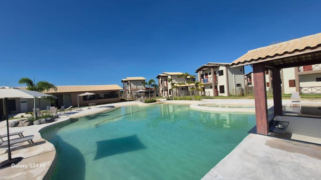 a large swimming pool in the middle of a building at Kite House Lençóis in Santo Amaro