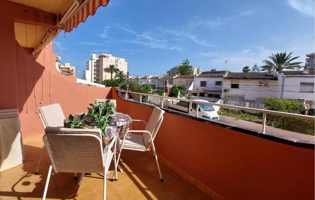 a balcony with a table and chairs on a balcony at Euromar Ii in Peñíscola