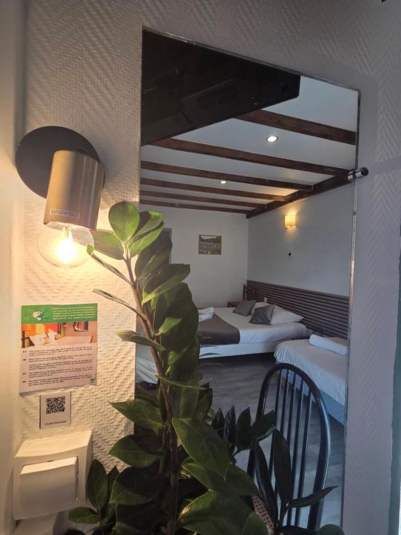 Postel nebo postele na pokoji v ubytování Hotel Magdeleine
