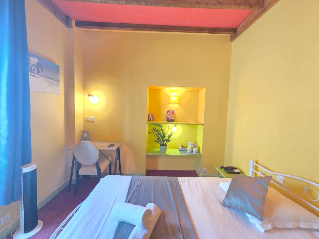 Postel nebo postele na pokoji v ubytování Hotel Magdeleine