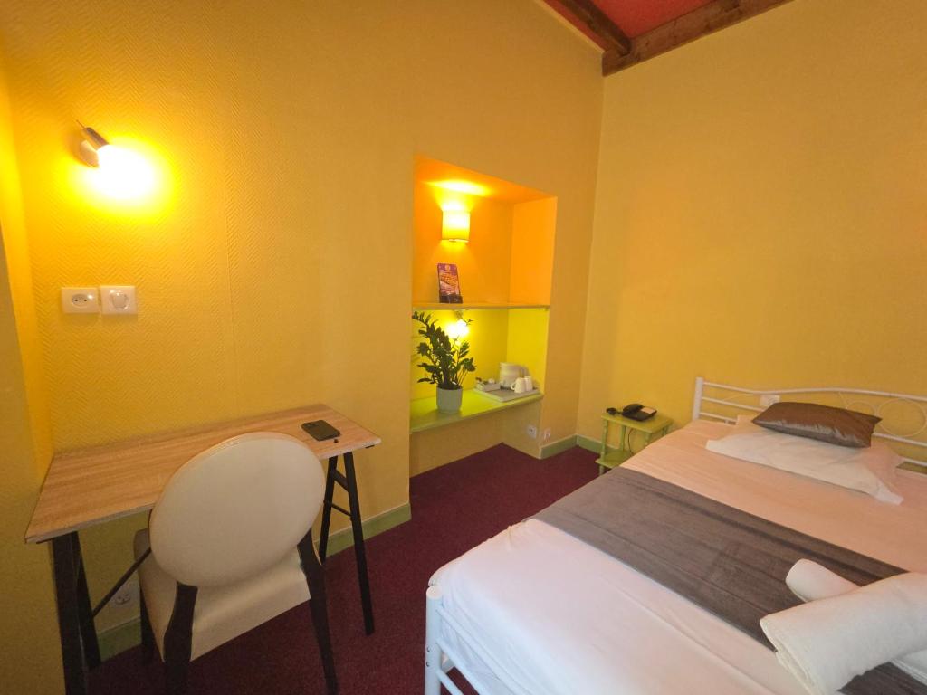 Postel nebo postele na pokoji v ubytování Hotel Magdeleine