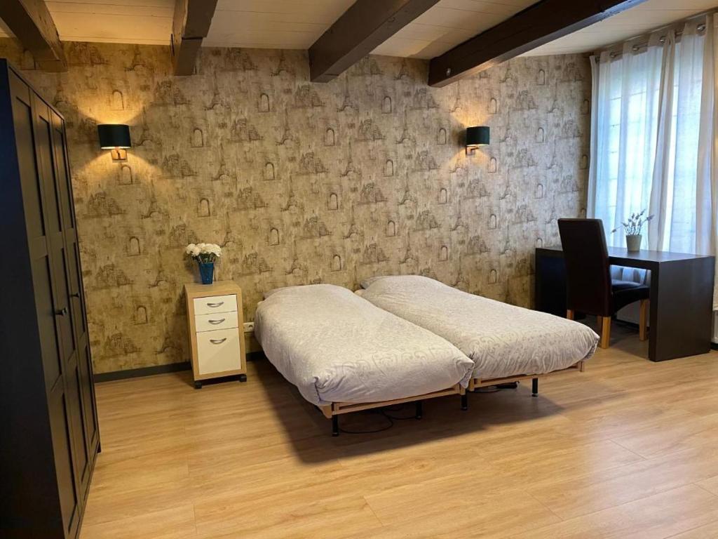 Voodi või voodid majutusasutuse Hotel DeWaag Makkum toas