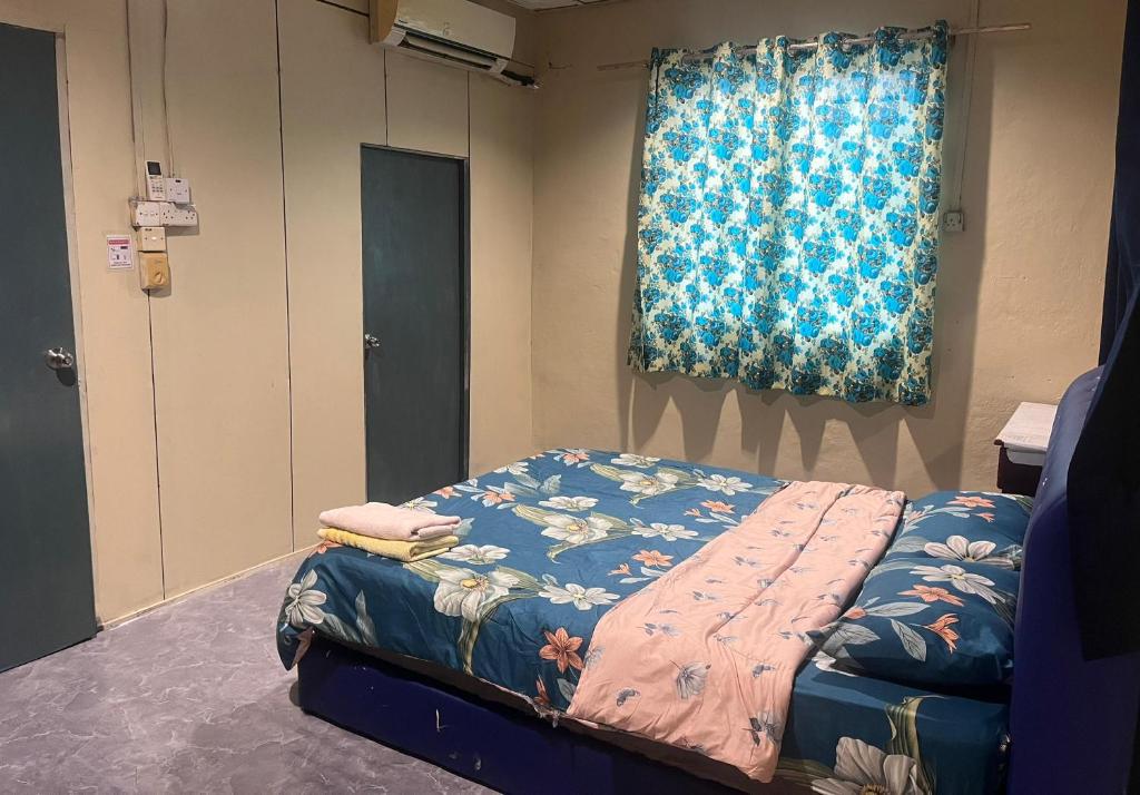 Postel nebo postele na pokoji v ubytování LD SWEET HOMESTAY LAHAD DATU