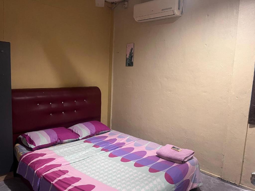 Postel nebo postele na pokoji v ubytování LD SWEET HOMESTAY LAHAD DATU