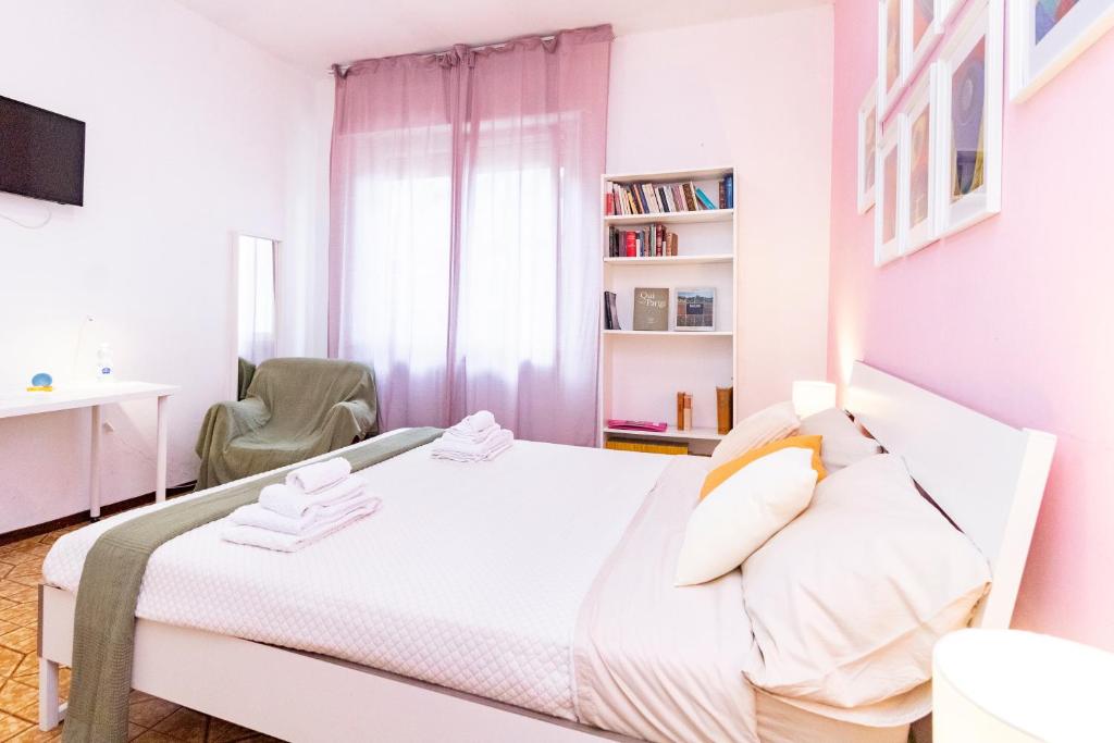 Postel nebo postele na pokoji v ubytování casa a colori