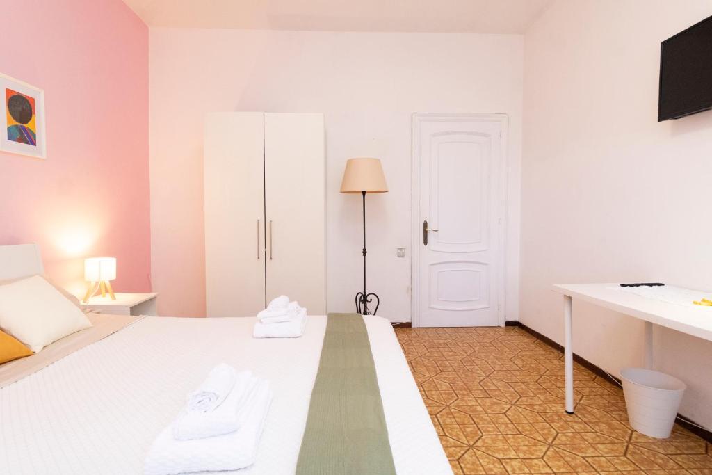 Postel nebo postele na pokoji v ubytování casa a colori