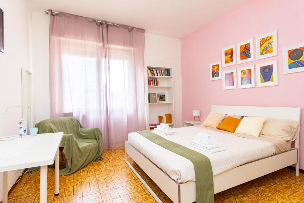 Postel nebo postele na pokoji v ubytování casa a colori