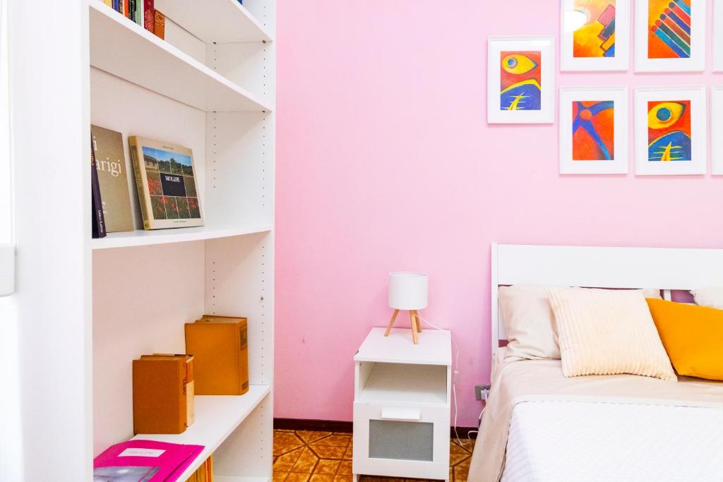 Postel nebo postele na pokoji v ubytování casa a colori