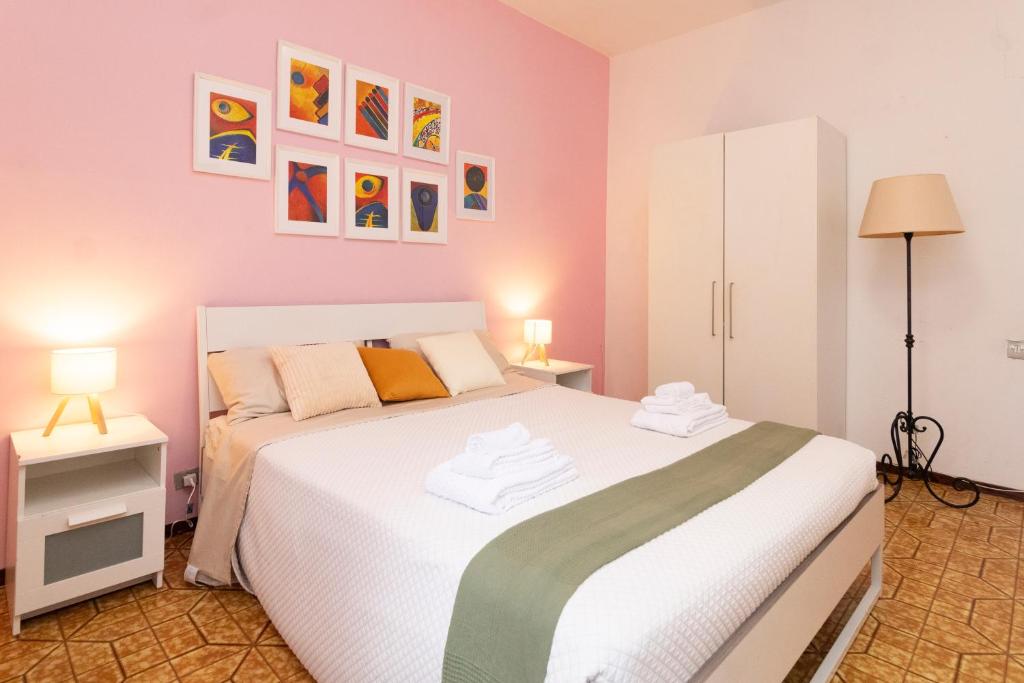 Postel nebo postele na pokoji v ubytování casa a colori