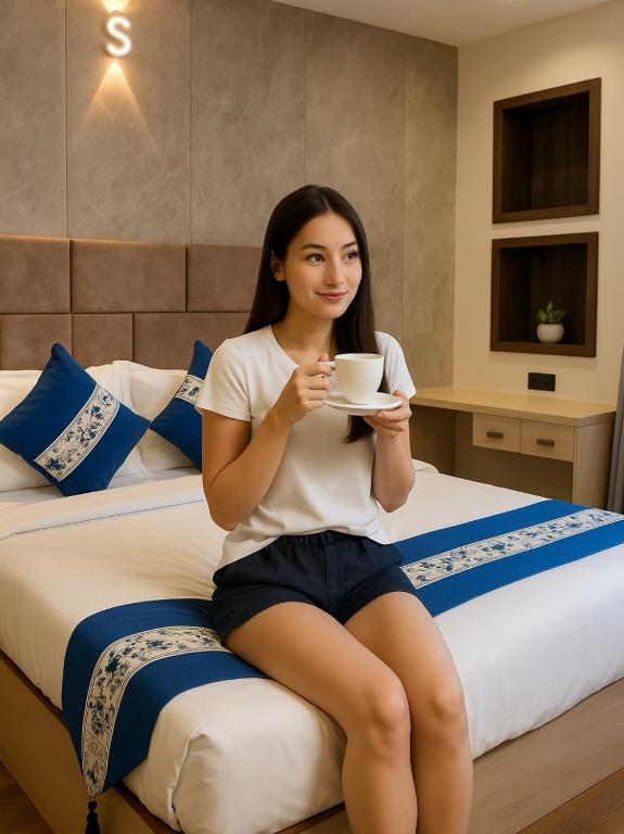 Postel nebo postele na pokoji v ubytování Hotel Smart Durbar