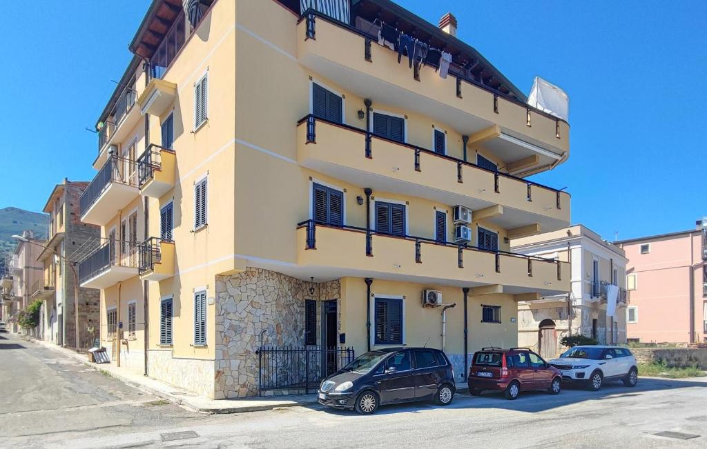 a building with cars parked in front of it at Nice Apartment In Acquedolci With Wifi in Acquedolci