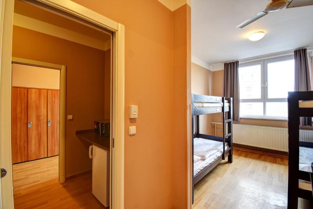 Łóżko lub łóżka w pokoju w obiekcie Plus Prague
