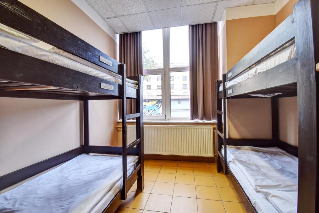 Łóżko lub łóżka w pokoju w obiekcie Plus Prague