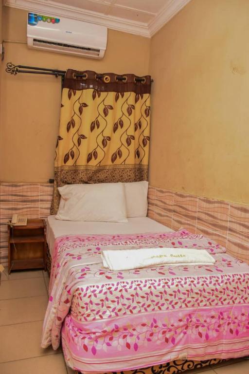 Postel nebo postele na pokoji v ubytování Abba Suites