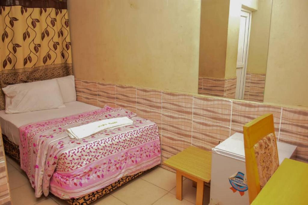 Postel nebo postele na pokoji v ubytování Abba Suites