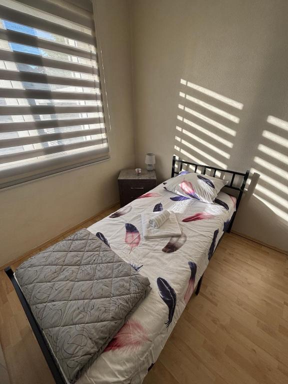 Postel nebo postele na pokoji v ubytování Apartmani Keka