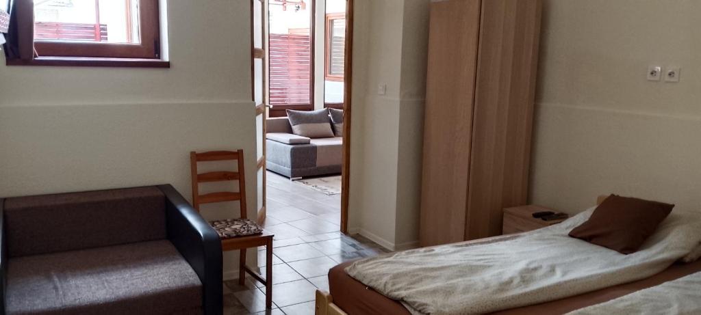 Posteľ alebo postele v izbe v ubytovaní Magnolia apartman