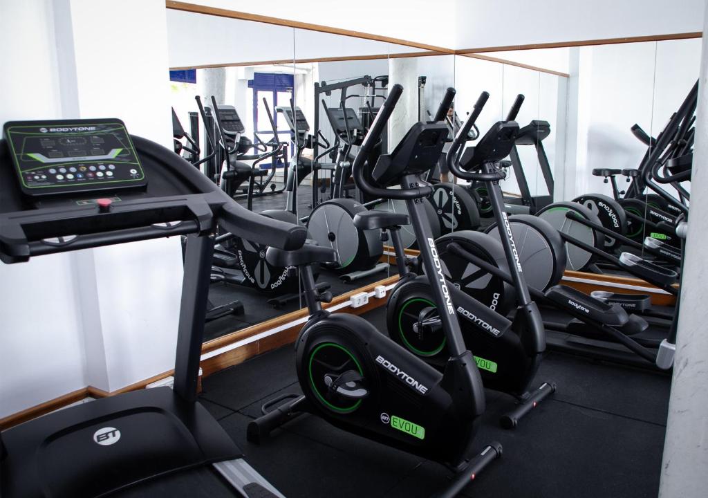 a gym with rows of treadmills and exercise bikes at Holiday Club Vista Amadores in Amadores