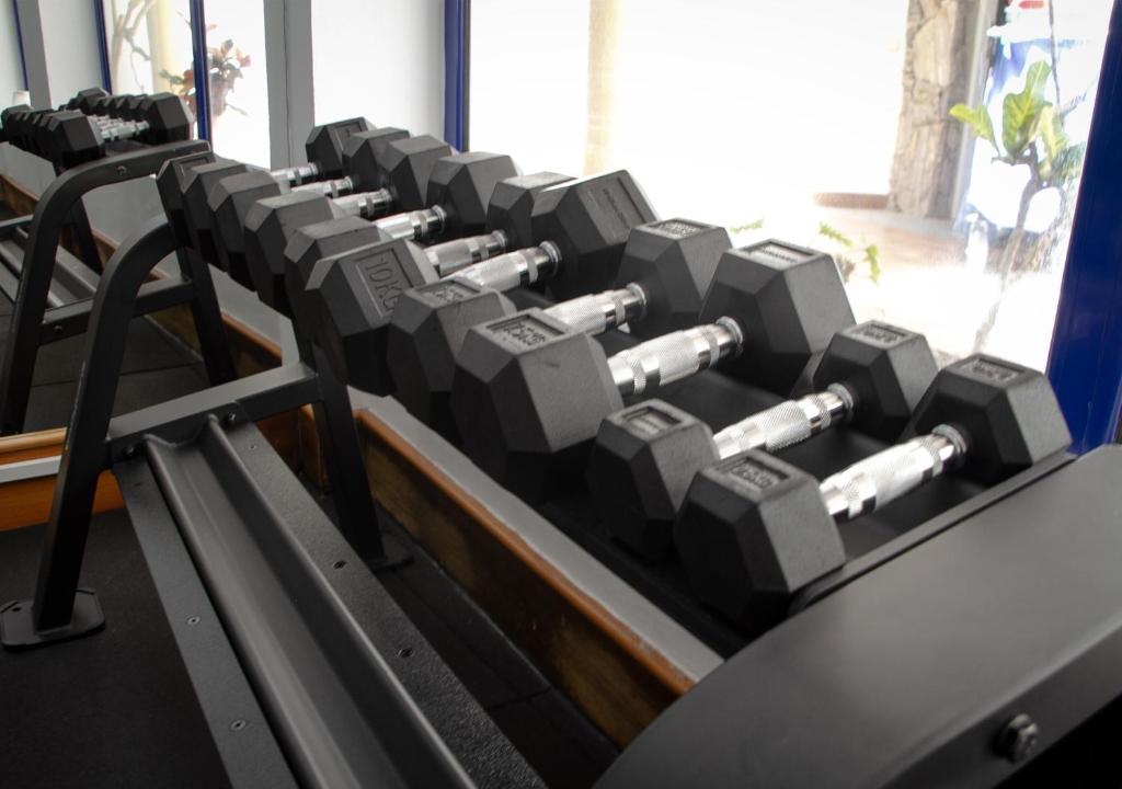 a row of exercise equipment in a gym at Holiday Club Vista Amadores in Amadores
