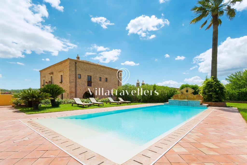 an image of a swimming pool in front of a villa at Casale degli Erei in San Michele di Ganzaria