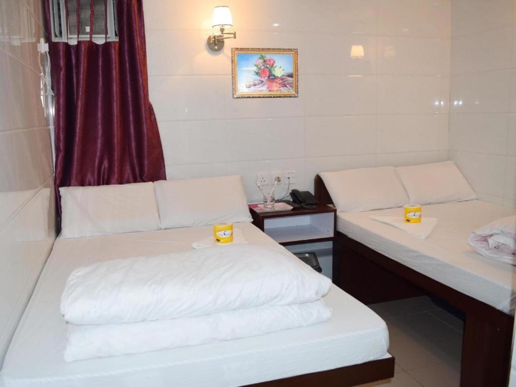 Postelja oz. postelje v sobi nastanitve Om Guest House
