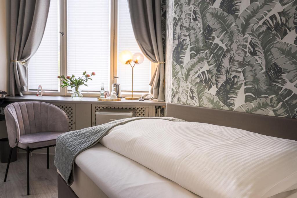 Postel nebo postele na pokoji v ubytování Hotel Augusta Am Kurfürstendamm