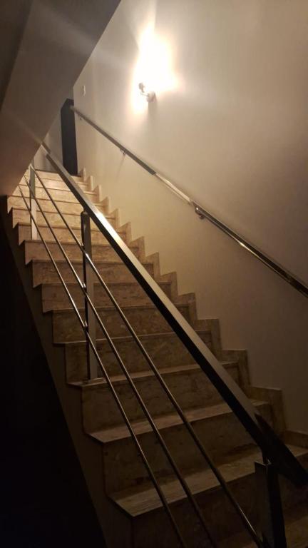 a staircase in a building with a light on the ceiling at Casa completa para COP30 in Castanhal