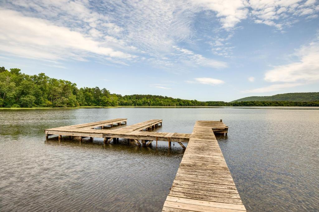a wooden dock in the middle of a lake at Fire Pit and BBQ Lake Guntersville Family Home in Hollywood