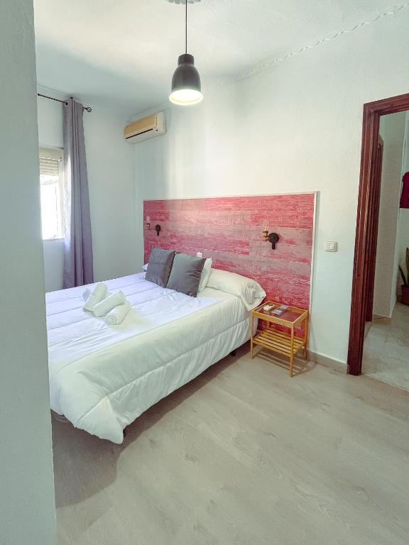 Postel nebo postele na pokoji v ubytování Hostal El Pinar