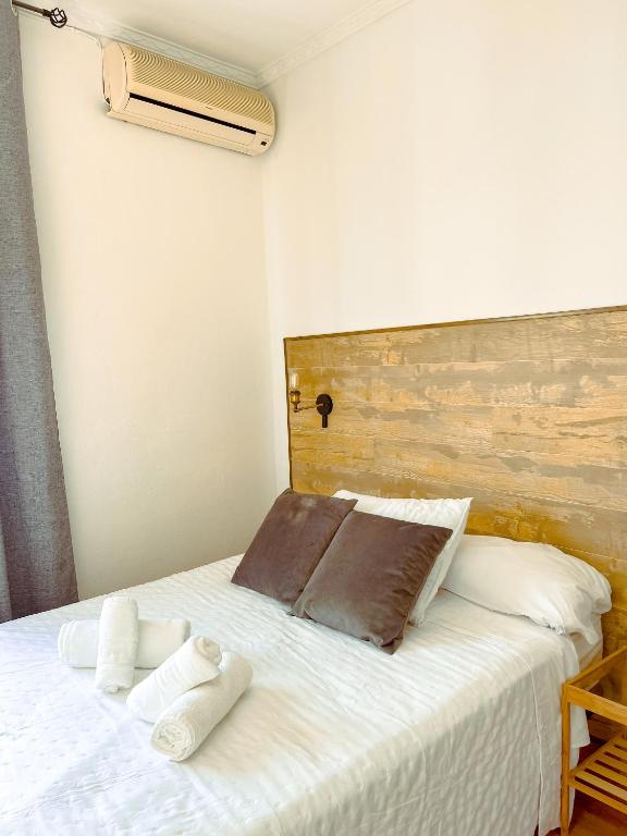 Postel nebo postele na pokoji v ubytování Hostal El Pinar