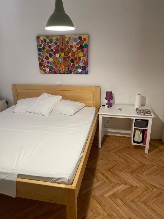 Postel nebo postele na pokoji v ubytování Apartment and rooms Jurišić