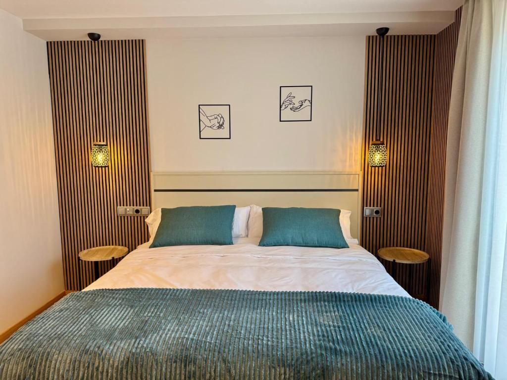 Postel nebo postele na pokoji v ubytování Hotel Ávila Diró