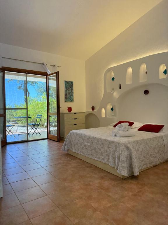 Postel nebo postele na pokoji v ubytování Green Hotel "I Mandorli di Dommos"